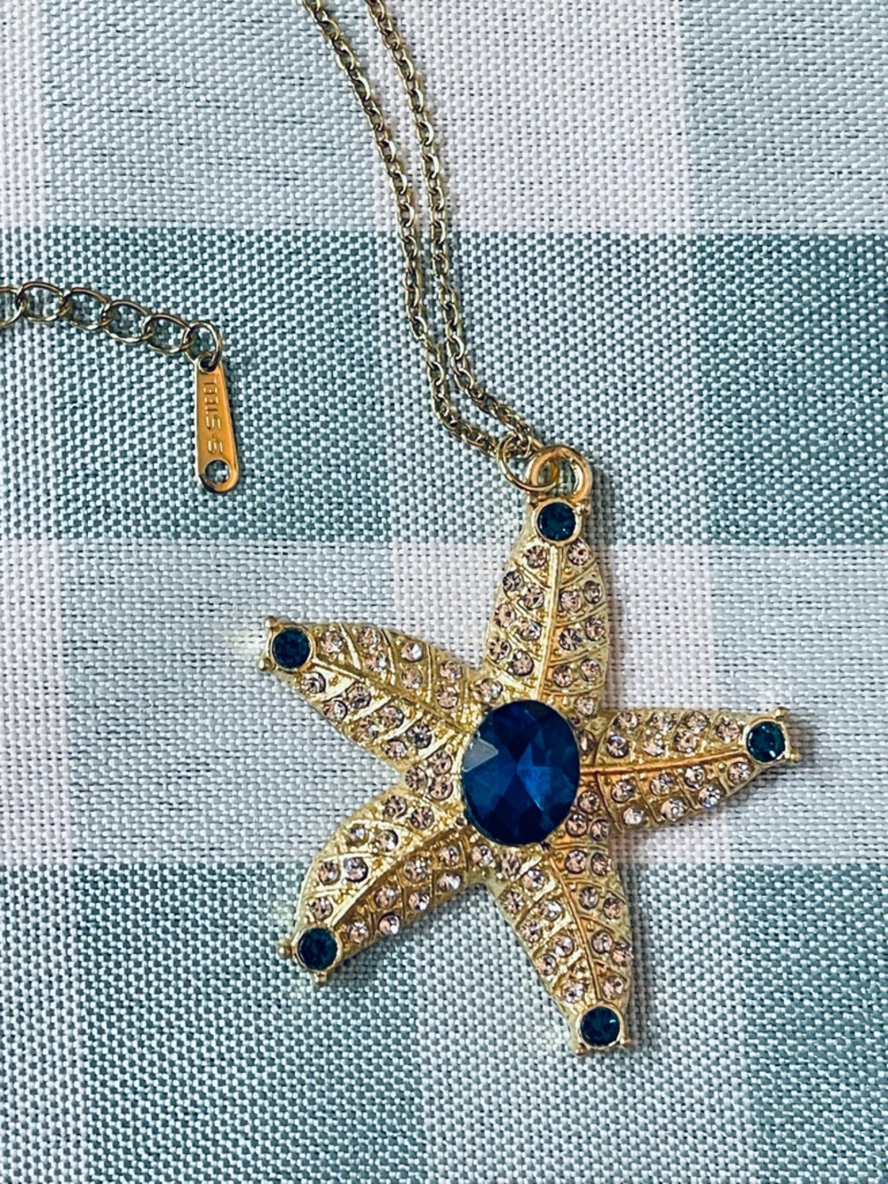 Gold Starfish Pendant Necklace with Deep Blue Stones